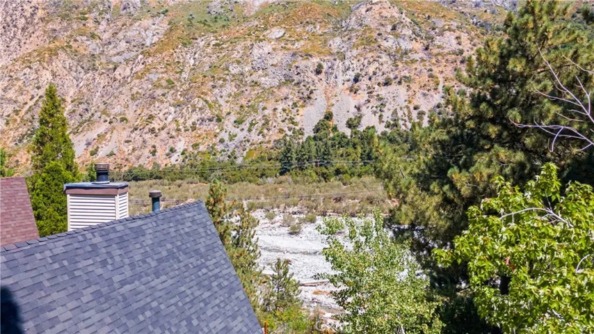Dwelling roof is in the foreground looking toward the North