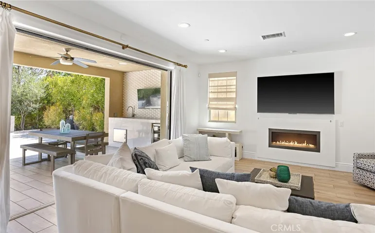 Folding doors create easy indoor/outdoor entertaining with additional dining space