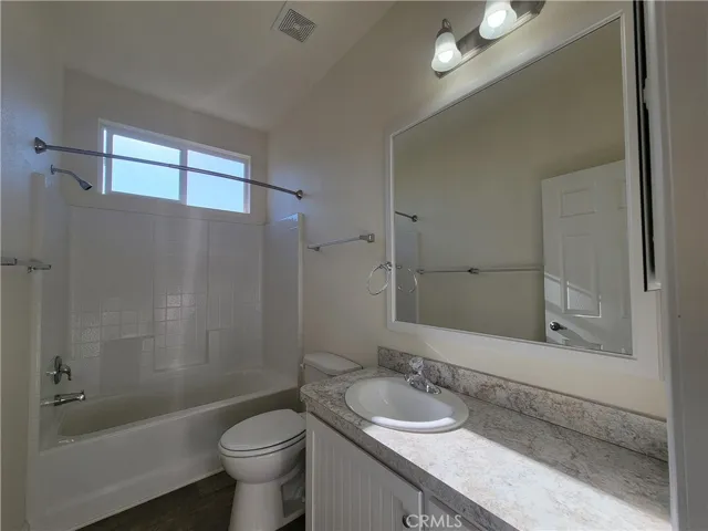 Natural light over the guest bath adds to the ambience.