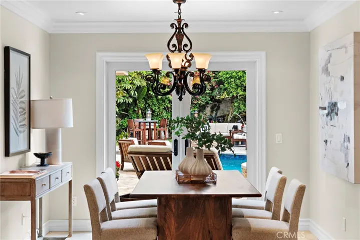 Dining area features French doors that open directly to the backyard oasis!