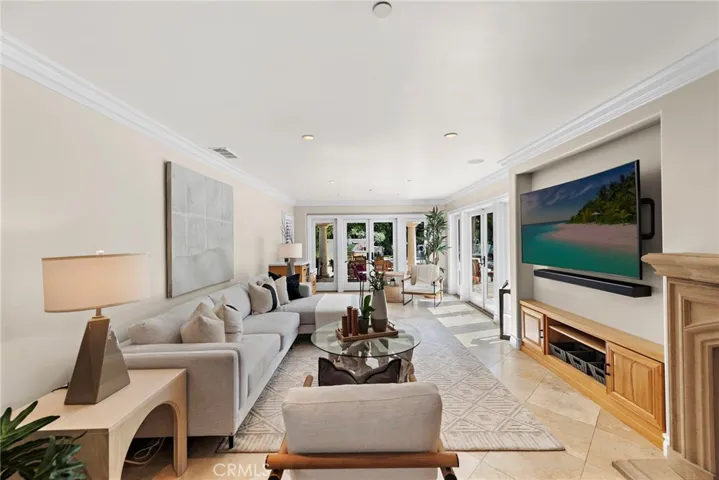 Family room features dual French doors connecting to the backyard for ideal indoor/outdoor living.