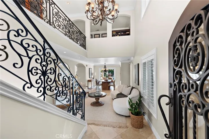 Elegant wrought iron details greet you at the entrance.