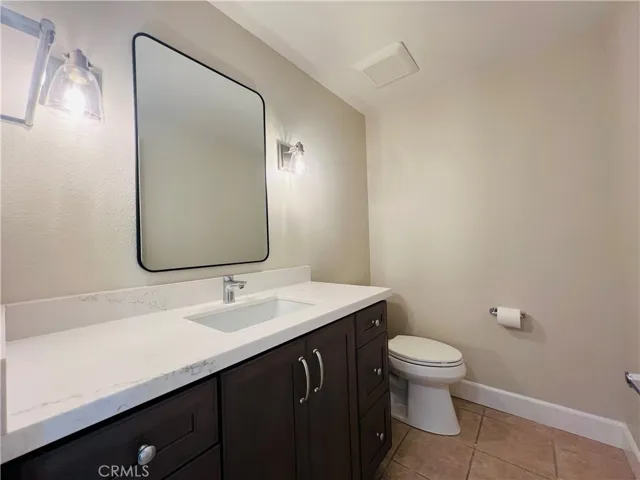 Powder room off the dining and garage area