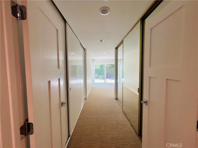 Hallway with closets in Primary Suite