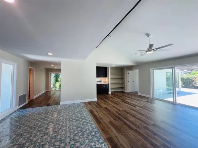 Entry looking toward dining room on left and counter/bar on right