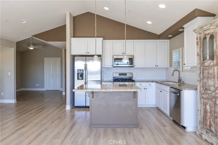 Beautiful Granite Countertops and Open Kitchen with space for bar stools!