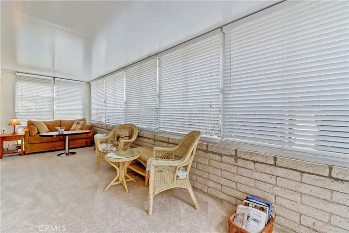 Enclosed Patio with door on both ends & doors into living room & guest bedroom