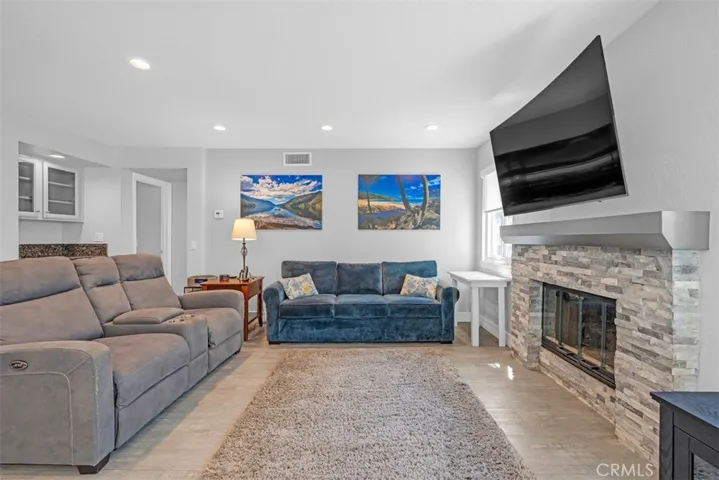 Relax & entertain in the family room with a wet bar and a cozy fireplace