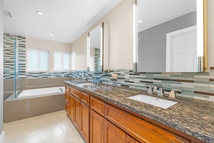 Luxurious remodeled Primary Bathroom includes a walk-in closet