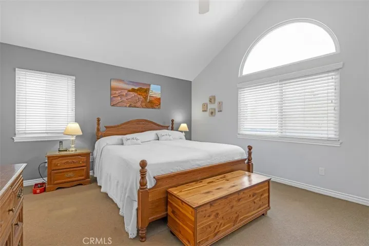Primary Bedroom (upstairs) with cathedral ceiling