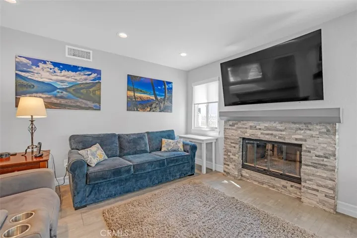 Family room with a beautiful stacked stone fireplace
