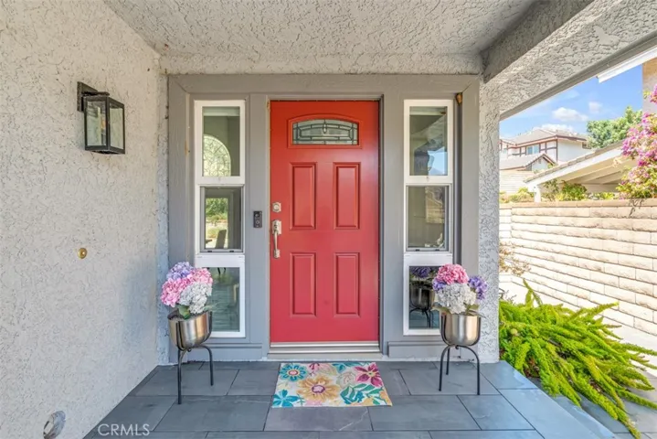 Front door w/leaded glass insert and vented sidelights