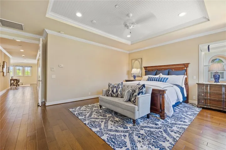 master retreat with double door entry leading into hall and loft area.
