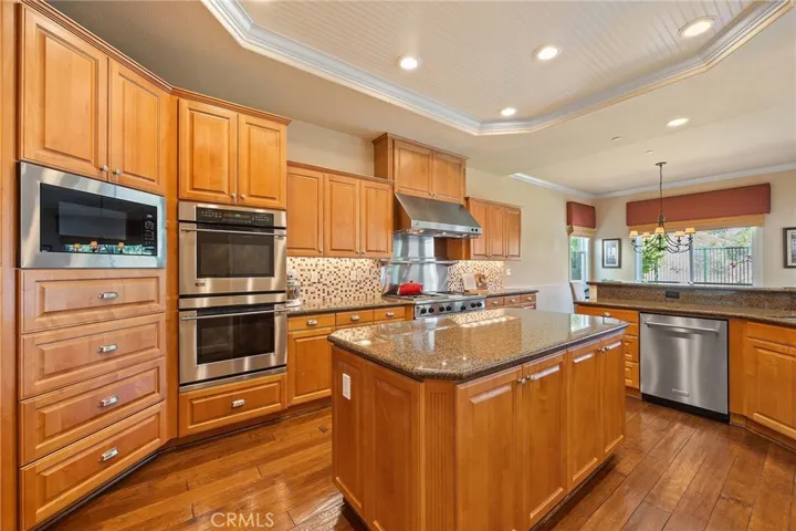 extra drawers and doors in kitchen, newer dishwasher and microwave.