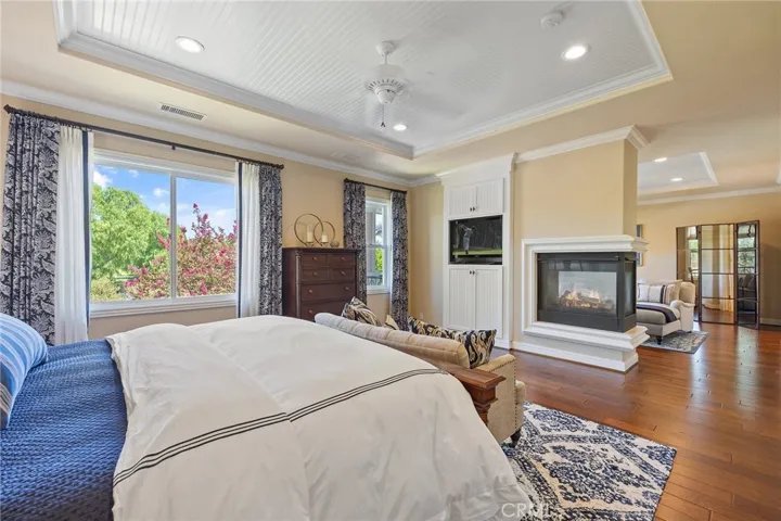 master retreat with views of the lush landscape.