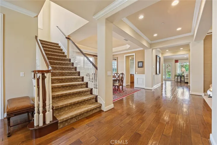 Formal entry and staircase, beautiful walnut hardwood floors.