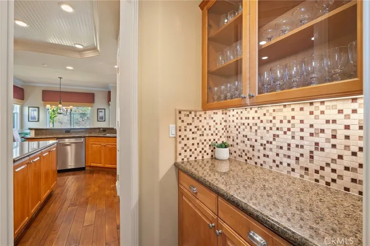butlers pantry with upgraded glass cabinet doors.