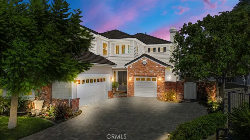 Paver driveway, 3 car garage, ample parking