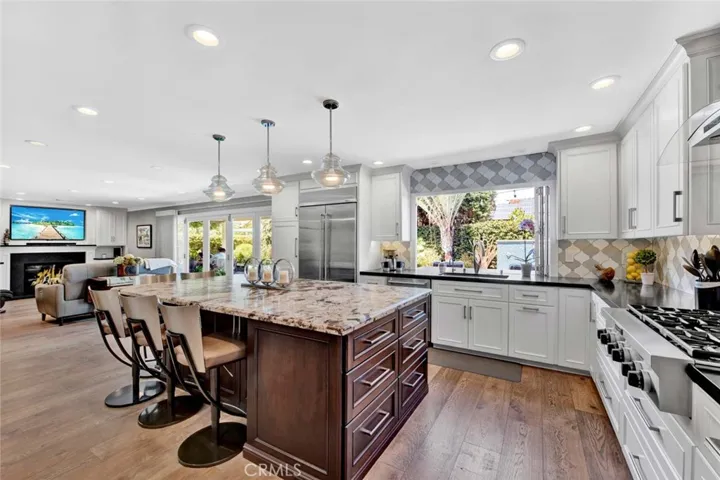 Leathered Granite Center Island with Pendant Lighting