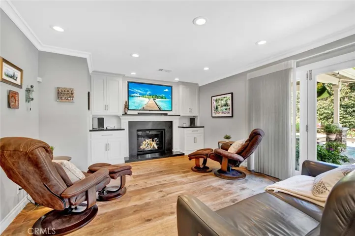 Built-In Cabinetry and Another custom Fireplace on Remote that Provides Fire, Heat, or Just Illuminated Light