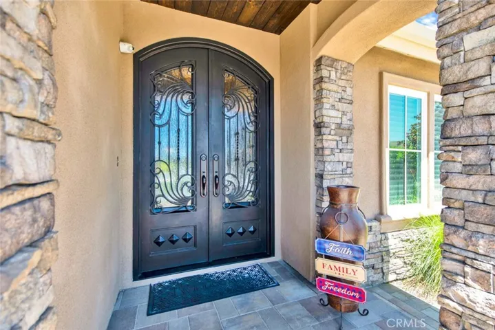 Massive Double Door Entry with Wrought Iron and Rain Glass that Opens for Soothing Ocean Breezes