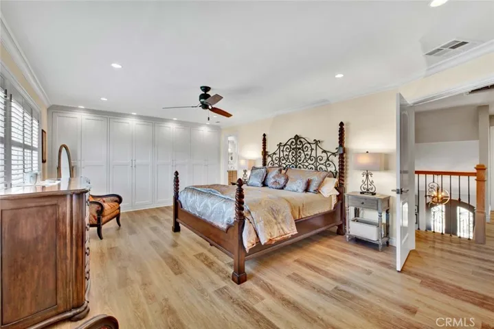 Luxurious Primary Suite has 2 Walls of Closets Behine Custom Solid Wood Soft-Closing Cabinetry