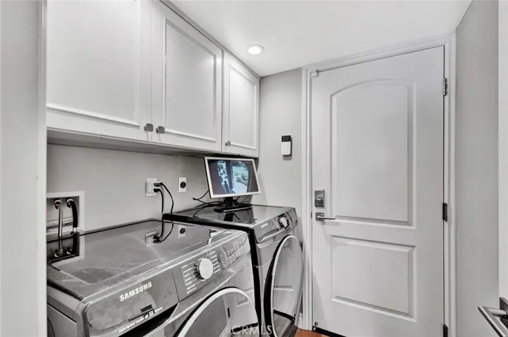 Inside Laundry Room and Direct Access to Fully Finished Exoxy Garage with EV Charger