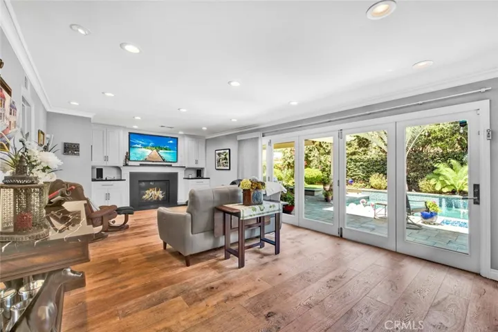 Amazing Family Room with Fireplace Wall of Bi-Fold Doors
