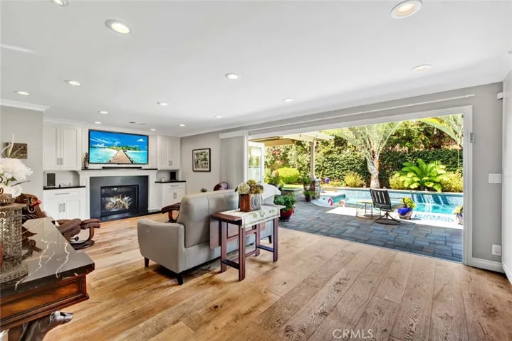 Here is the Family Room with the Bi-Fold Doors Open! Suddenly there is a Seamless Transition from Indoor to Outdoor Living! Amazing!!