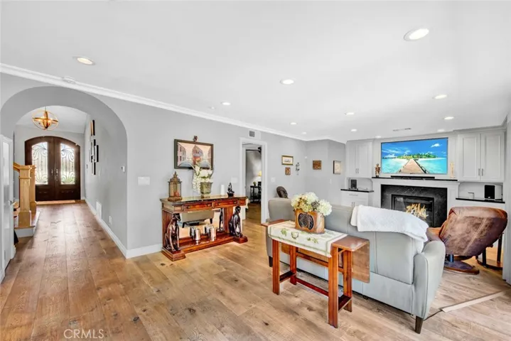 Family Room with Arched Passage to the Living Room and Entry
