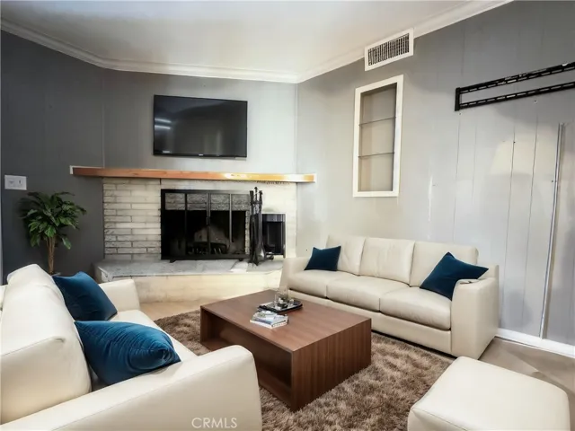 Cozy Brick Fireplace. Virtually Staged