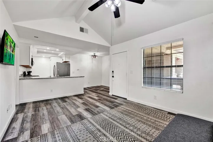 Gray tone vinyl waterproof hardwood flooring throughout.