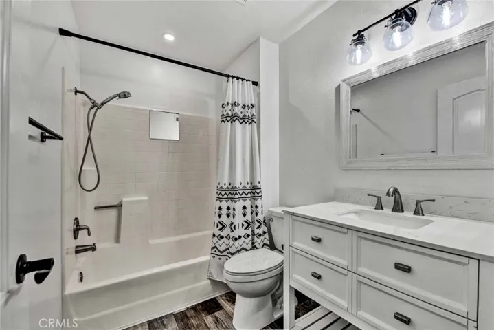 Upgraded farmhouse sink, newer fixtures, newer lighting, custom mirror.