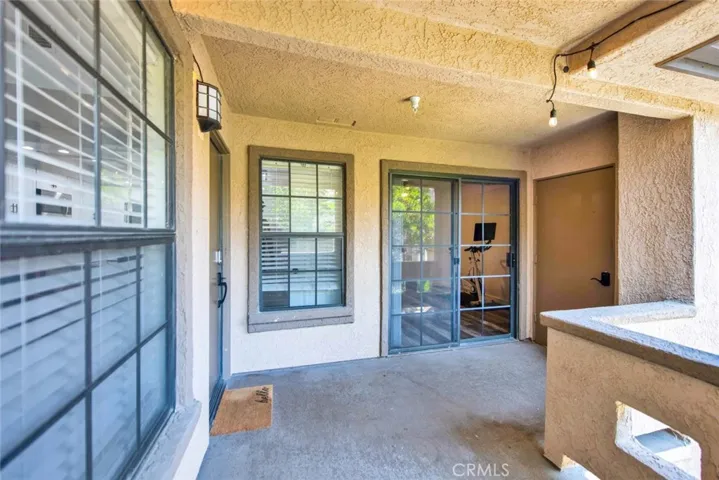 Views from the second master bedroom, kitchen eating area and living room into the balcony. Security door to the right with code for entry.