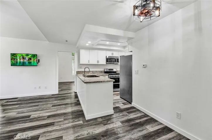 Kitchen eating area, upgraded modern light fixture.