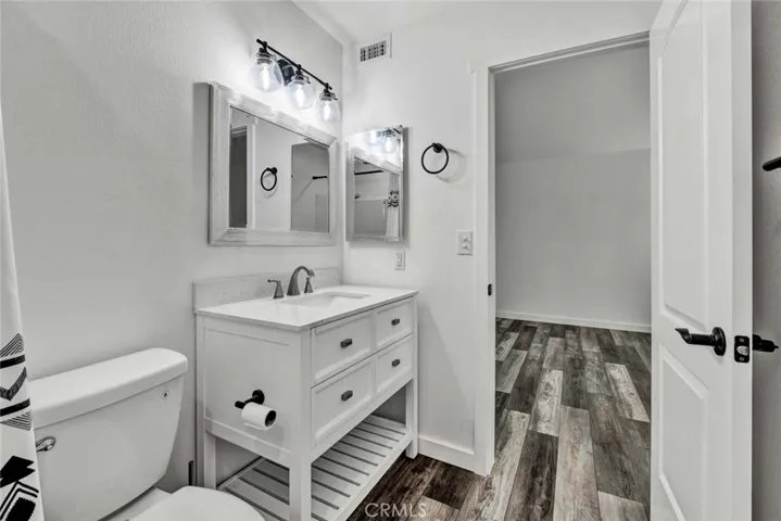 Another view of upgraded bathroom looking into the bedroom.