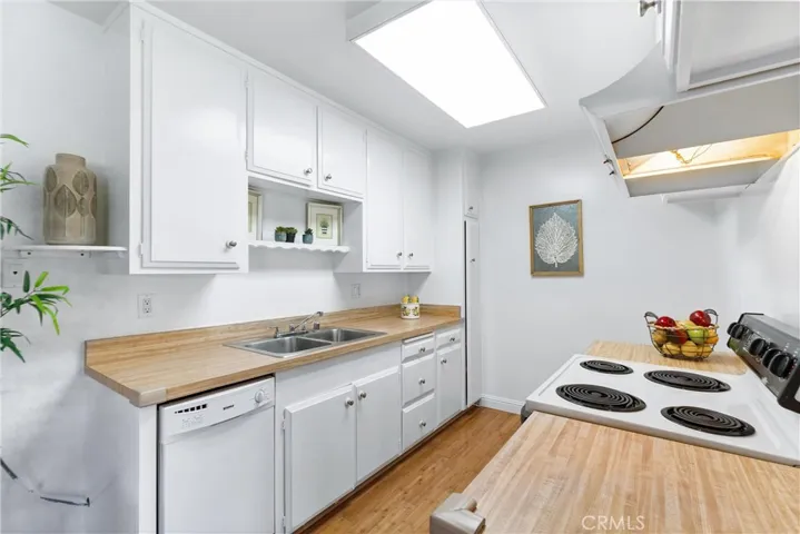 Galley kitchen with plenty of storage..