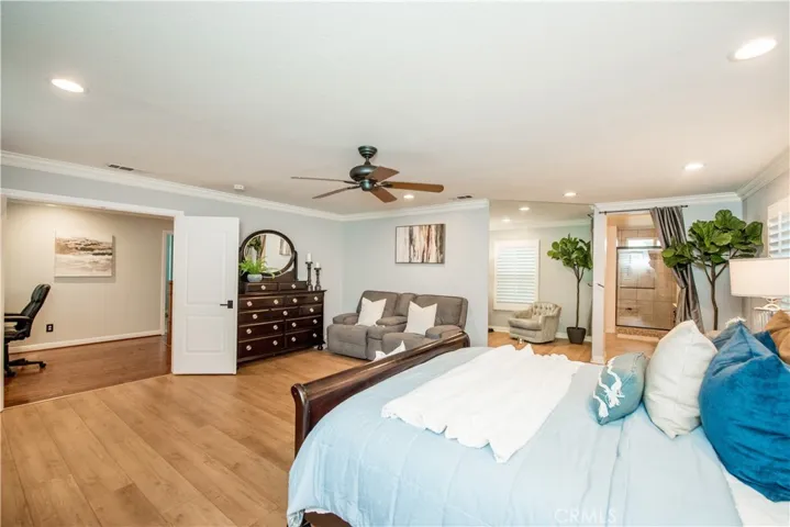 Over sized master bedroom, with a mirrored wall.