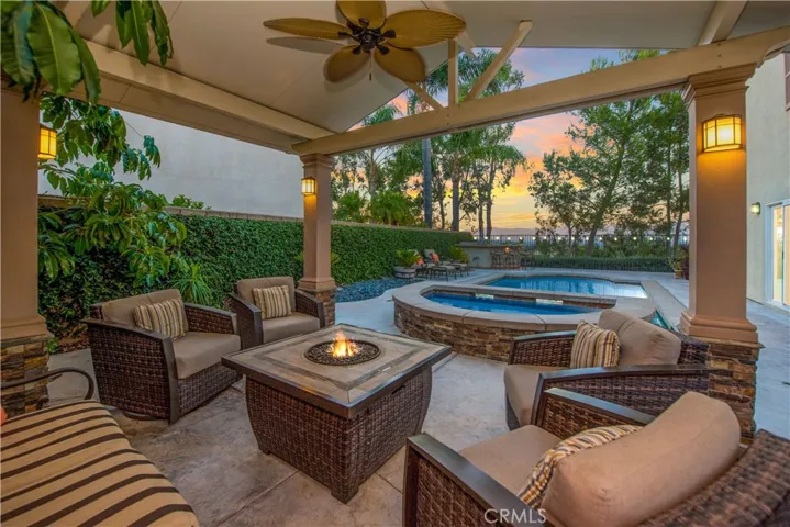 Fire-pit and swivel chairs stay with the house.