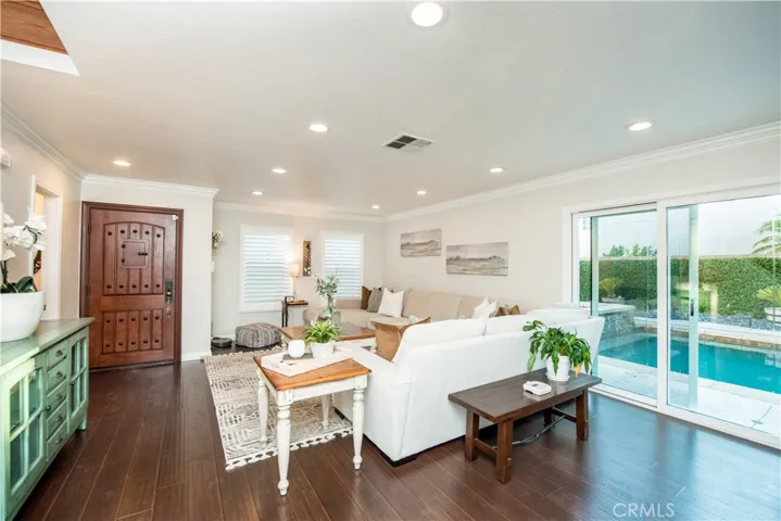 Living room, with a pool view.