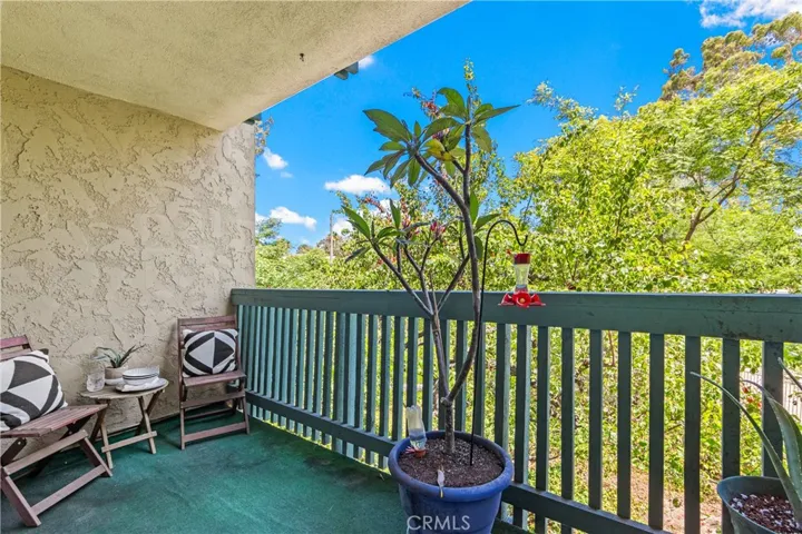 Enjoy looking down onto the smaller pool while enjoying the tree canopy on your private balcony