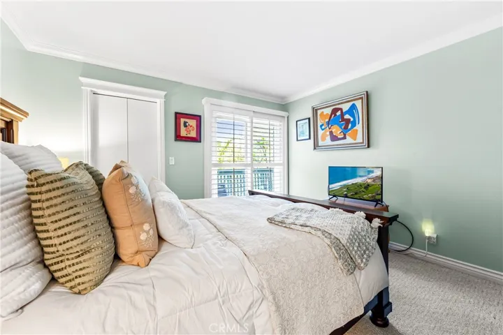 Large bedroom with walk in closet and private access to the balcony.