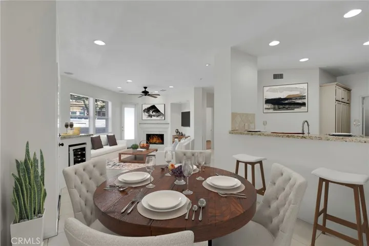 VIRTUALLY STAGED! Dining, kitchen and living rooms