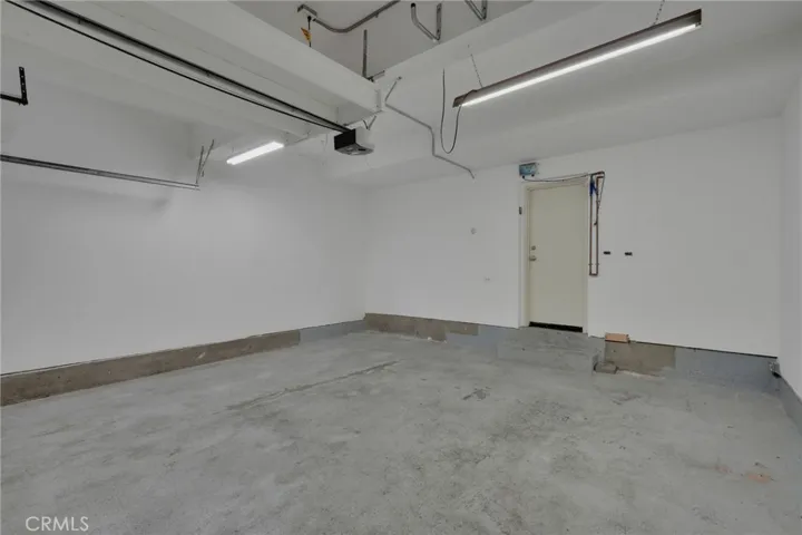 Two car garage, entrance into the condo