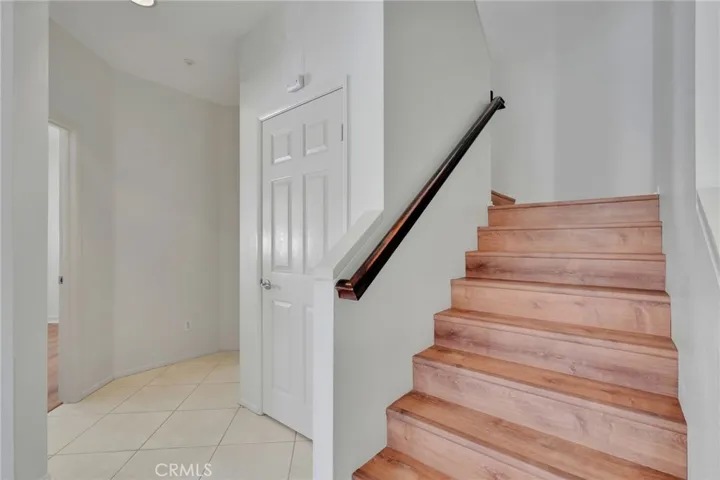 Downstairs hallway, hall closet, staircase