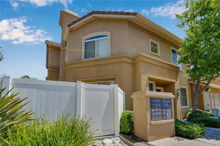 Left side view of condo and patio gate entrance