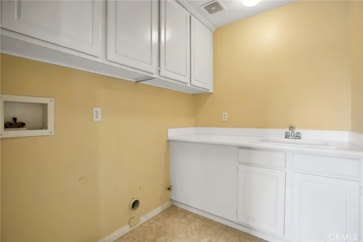 Laundry room with sink