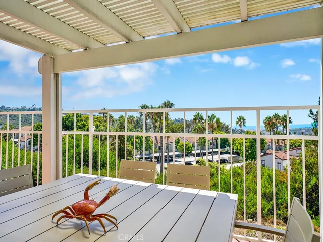 The pergola provides privacy and shade in your ocean view backyard.