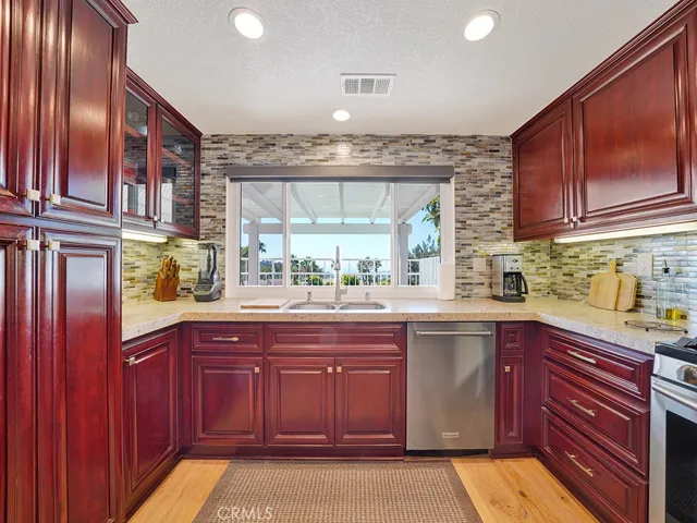 Another view of the fully remodeled kitchen which also showcases beautiful ocean views.