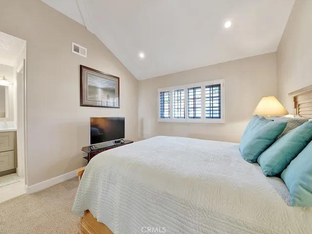 Another view of the guest bedroom showing the ensuite bathroom.